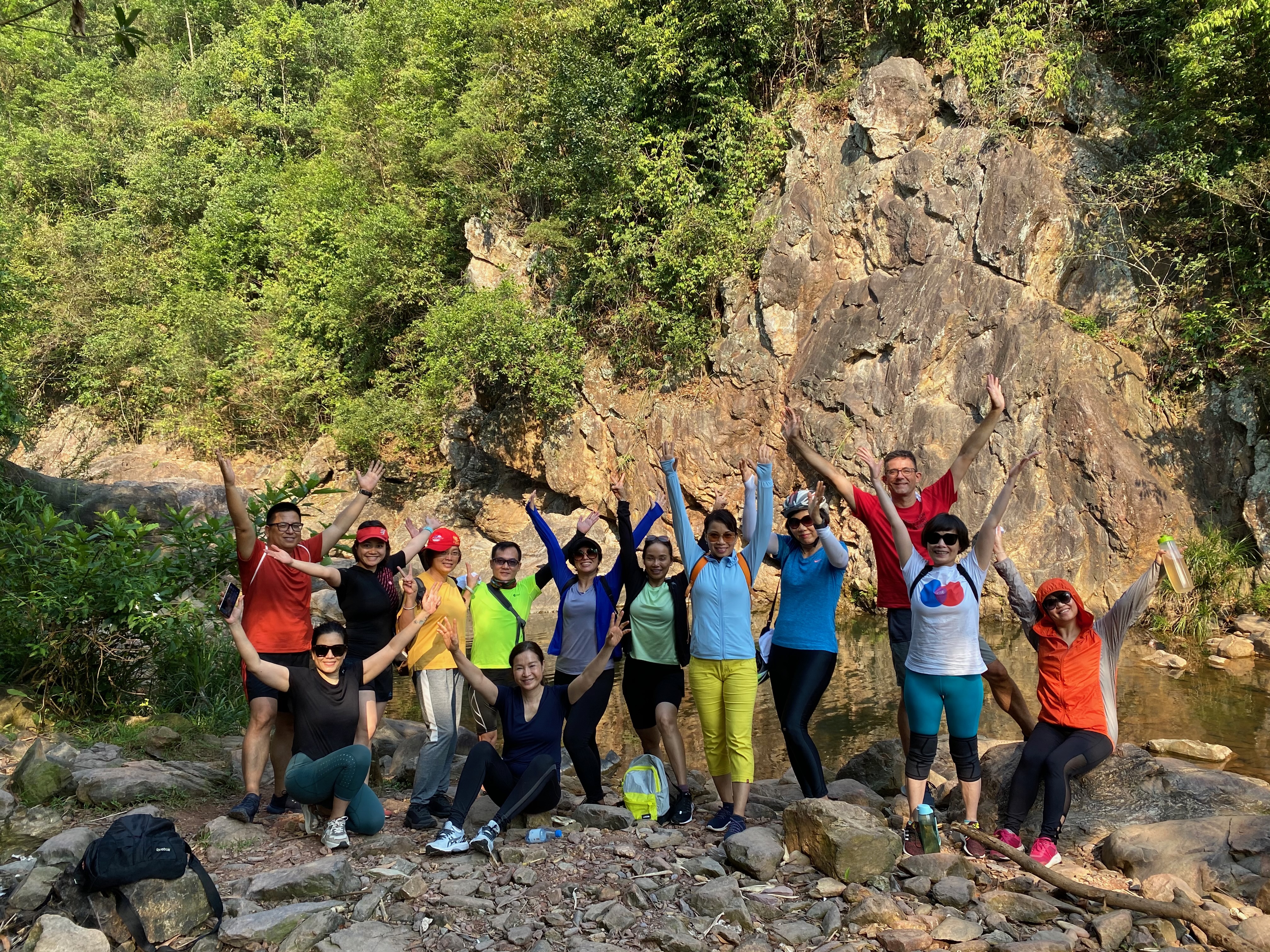 Guests celebrating together after a morning stream walk at Alba Wellness Valley Hue